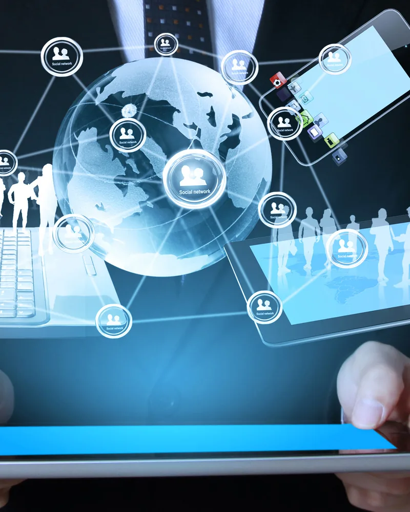 Hands holding a tablet with connected business systems