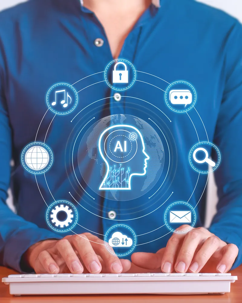 Team member working with AI-assisted tools at a keyboard